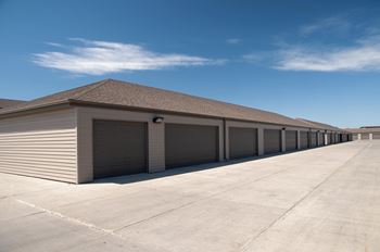 Large driveway with detached garage parking available.